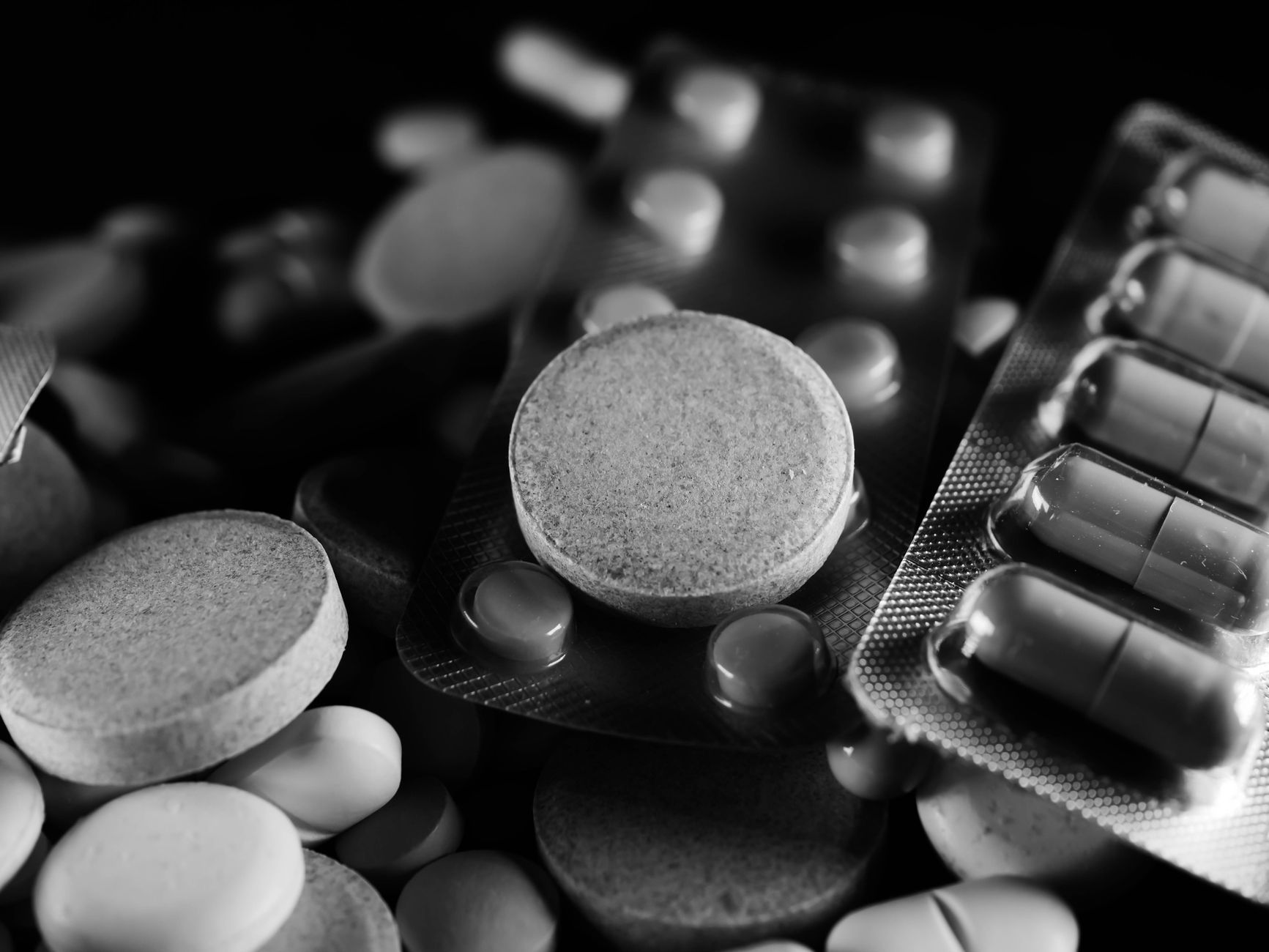 grayscale photo of medicines and drugs