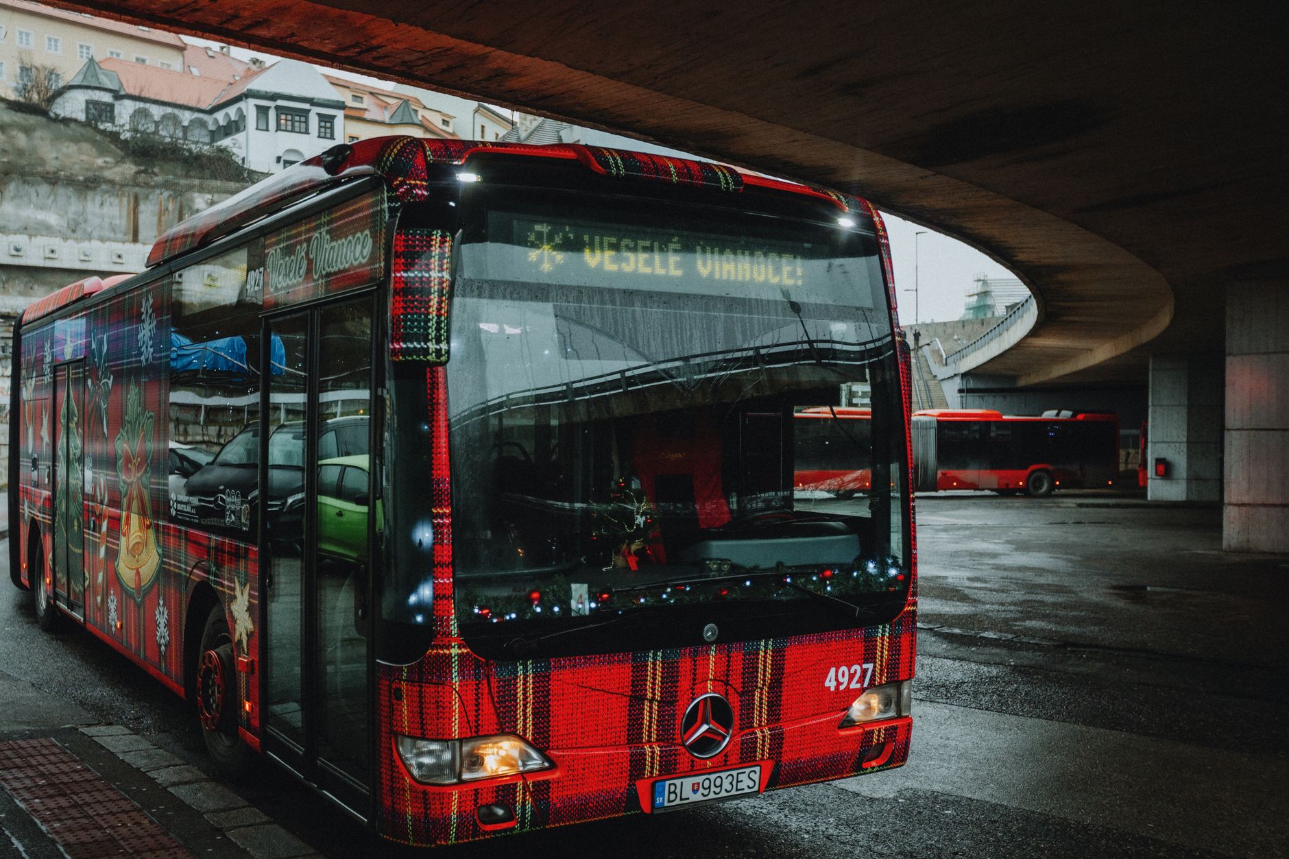 festive bus with christmas decorations in city