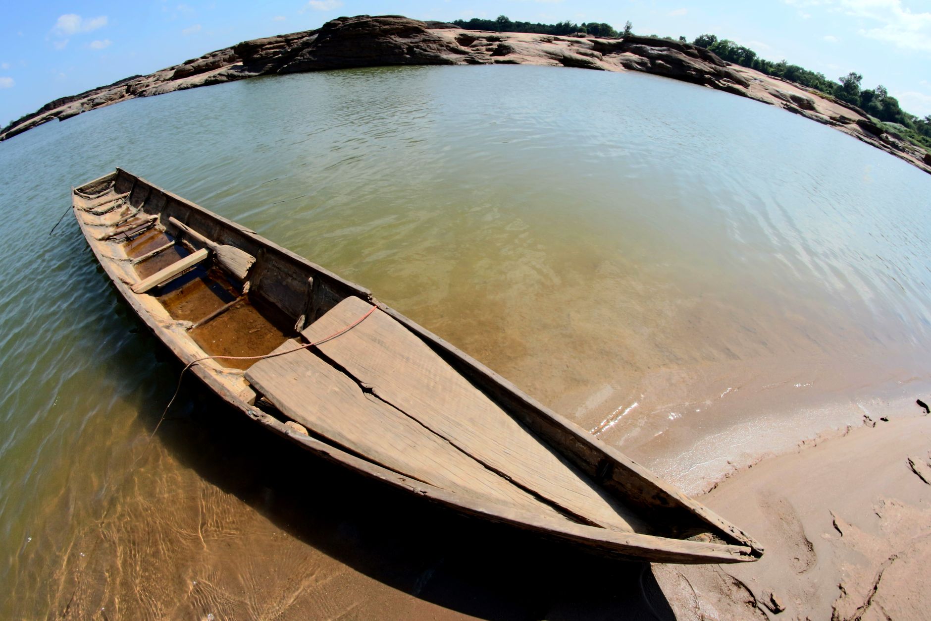 gray canoe at shoreline