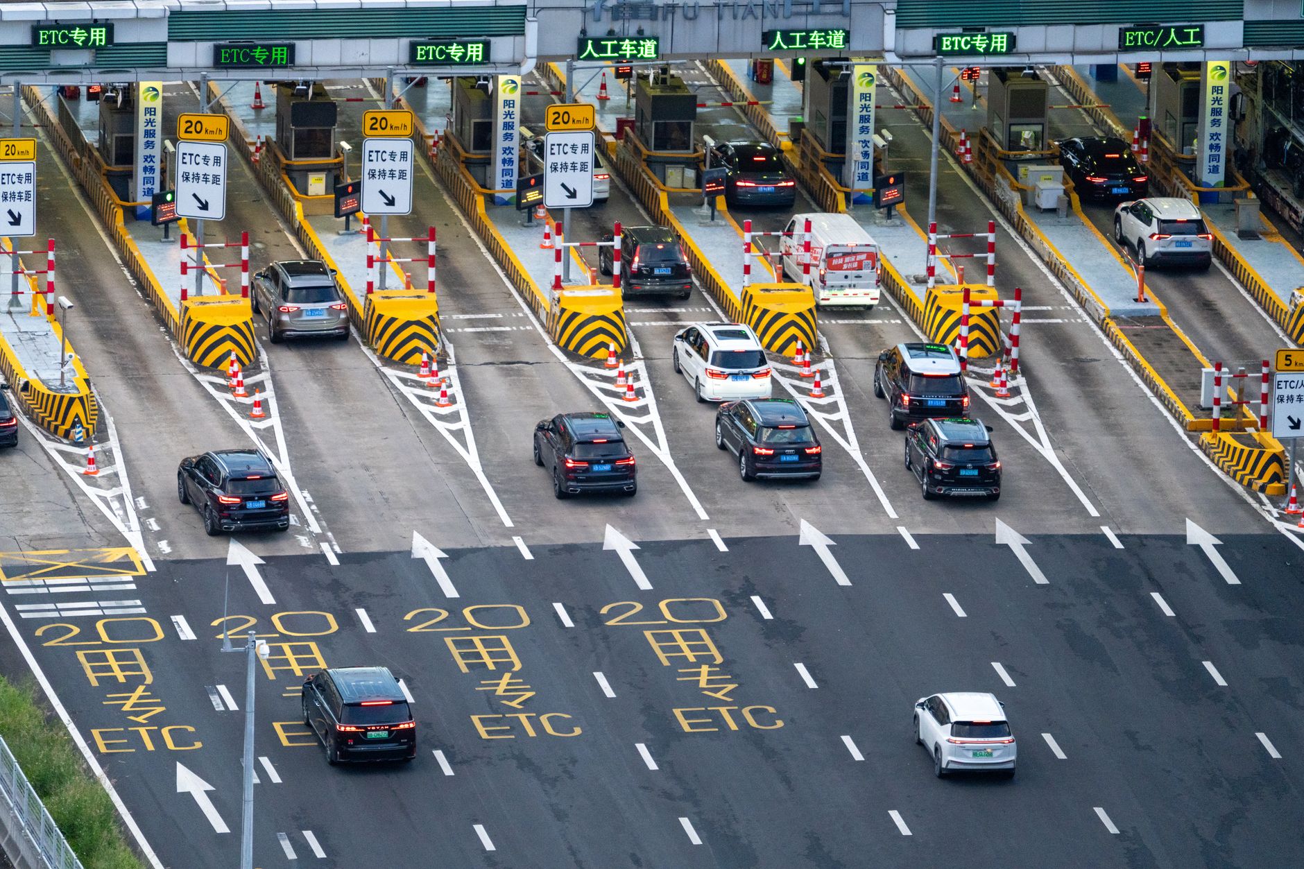 aerial view of toll plaza with cars in lanes